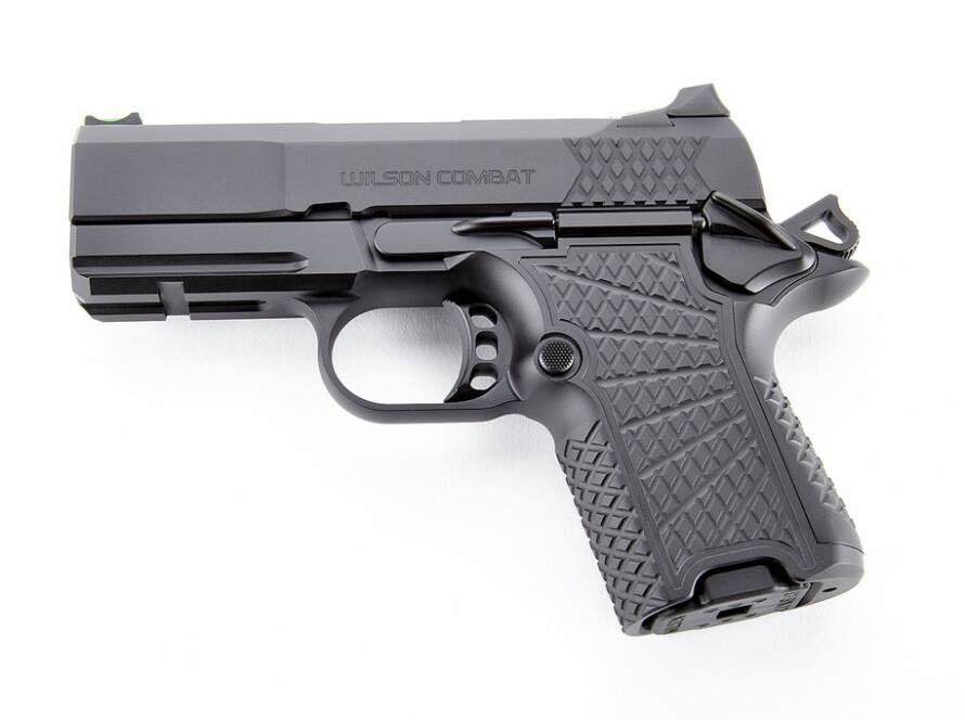 Wilson Combat SFX9 solid frame 1911 handgun showcasing aluminum grip and fluted bull barrel.